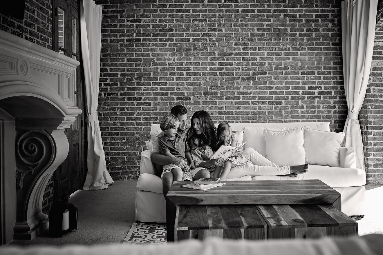 Westlake family reading together on sofa photo by Sunny Mays
