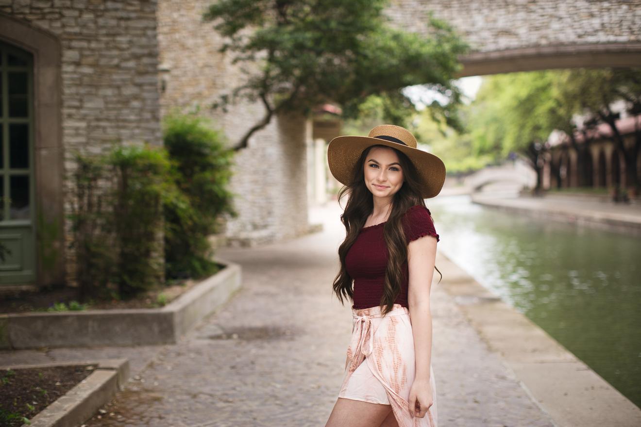  Teen girl photo with a hat on by a river