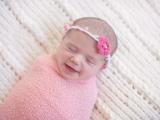 image of smiling newborn baby girl in Ft. Worth Dallas by Sunny Mays Photography